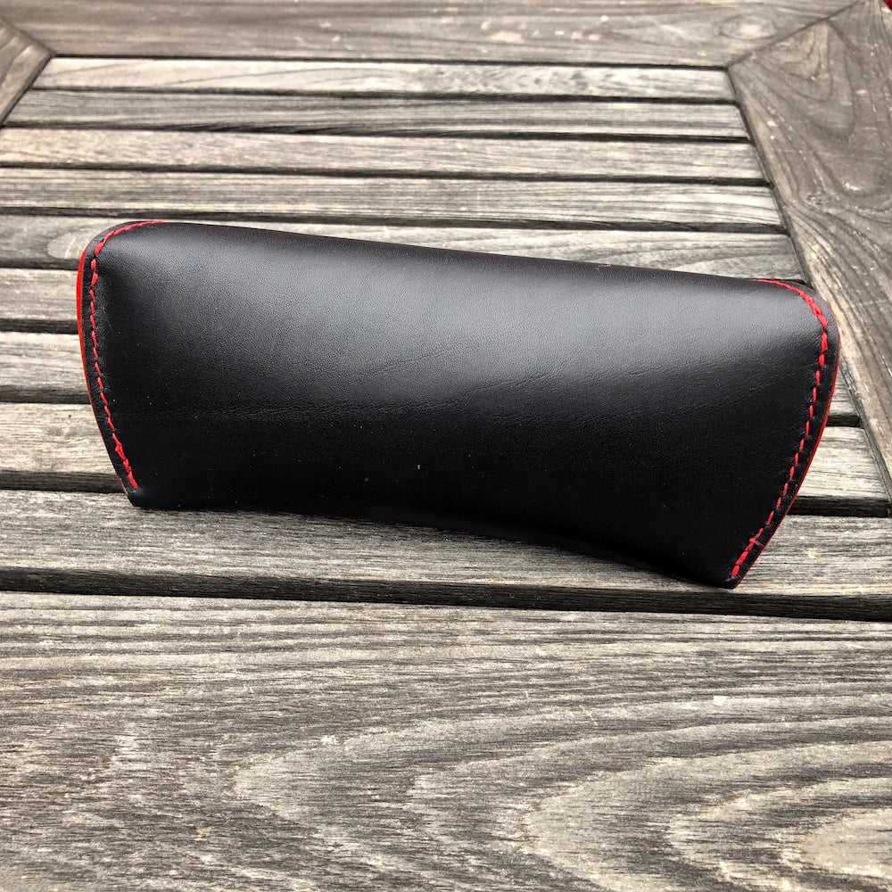 U.S. sourced, saddle stitched cowhide leather case with deerskin lining for prescription eyeglasses and sunglasses. Handcrafted protective case for eyeglasses and sunglasses with magnetic clasp, unisex.