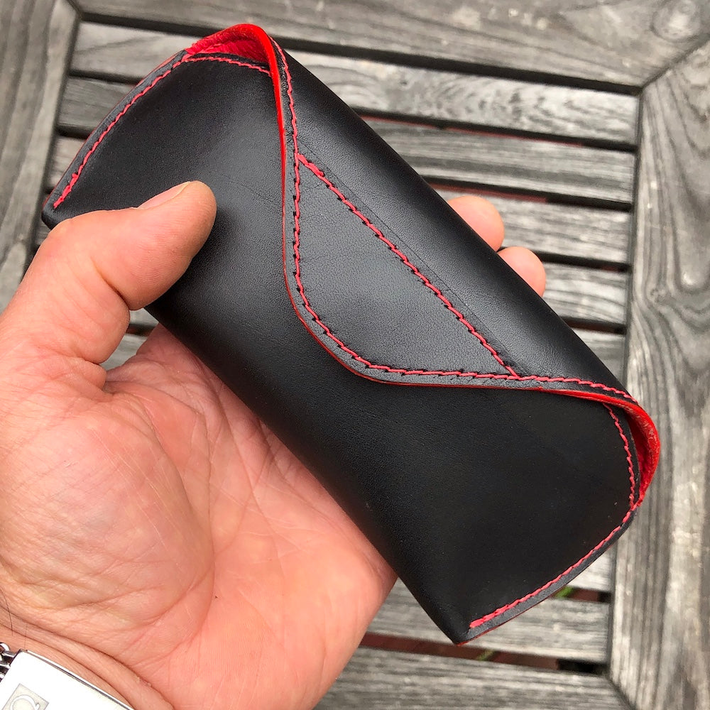 U.S. sourced, saddle stitched cowhide leather case with deerskin lining for prescription eyeglasses and sunglasses. Handcrafted protective case for eyeglasses and sunglasses with magnetic clasp, unisex.