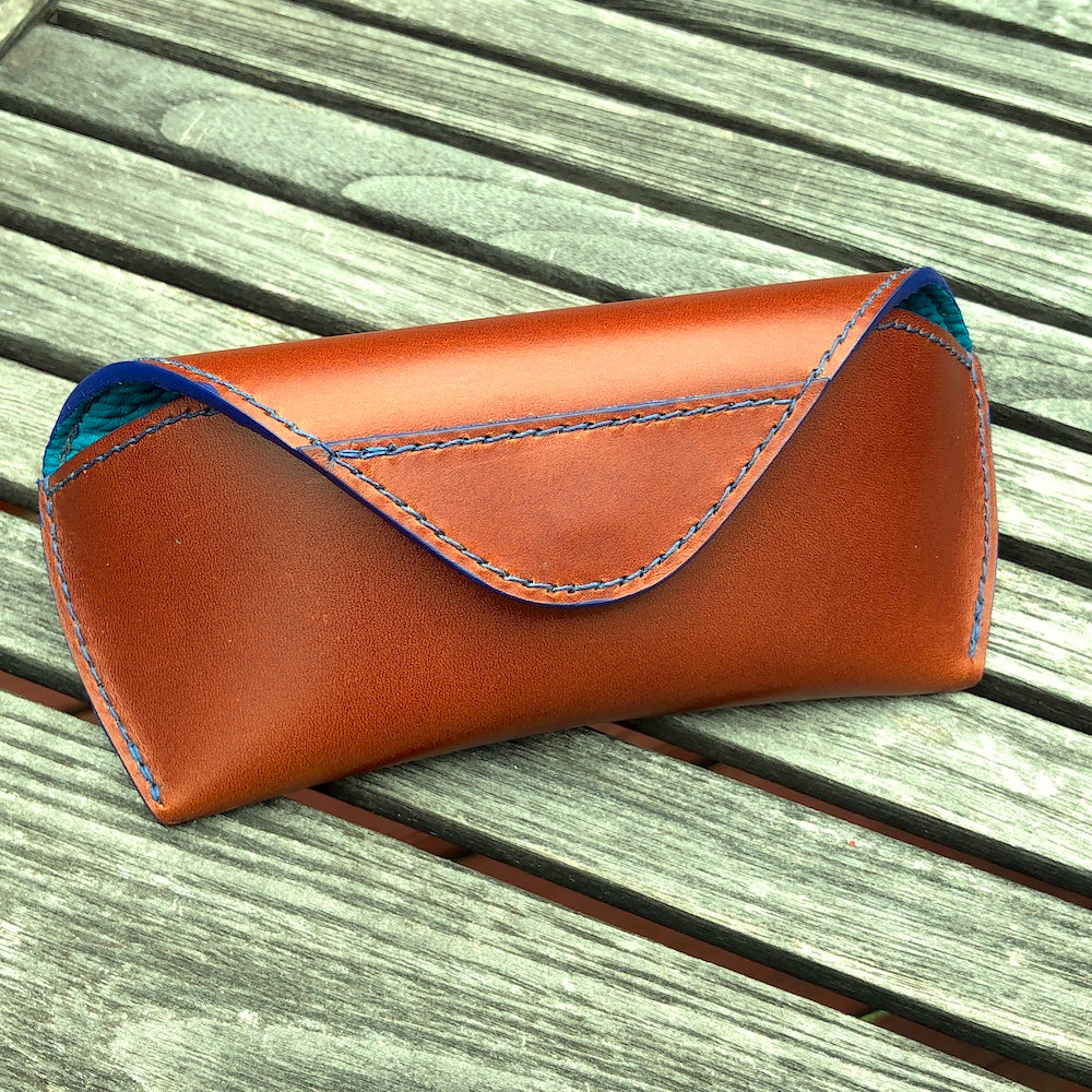 U.S. sourced, saddle stitched cowhide leather case with deerskin lining for prescription eyeglasses and sunglasses. Handcrafted protective case for eyeglasses and sunglasses with magnetic clasp, unisex.