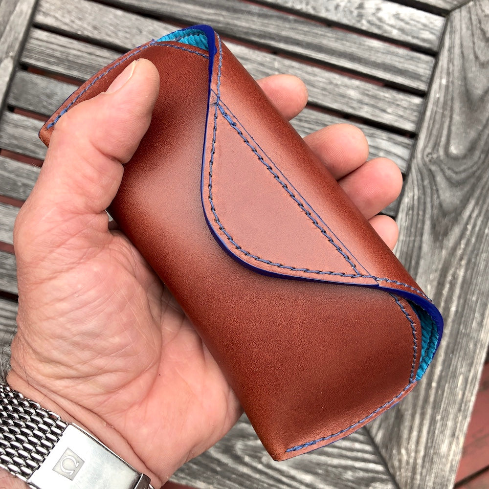 U.S. sourced, saddle stitched cowhide leather case with deerskin lining for prescription eyeglasses and sunglasses. Handcrafted protective case for eyeglasses and sunglasses with magnetic clasp, unisex.