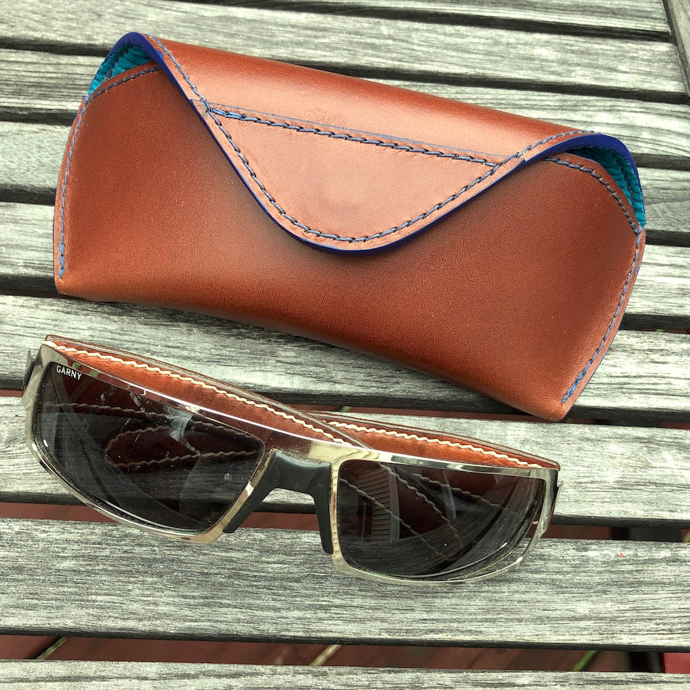 U.S. sourced, saddle stitched cowhide leather case with deerskin lining for prescription eyeglasses and sunglasses. Handcrafted protective case for eyeglasses and sunglasses with magnetic clasp, unisex.