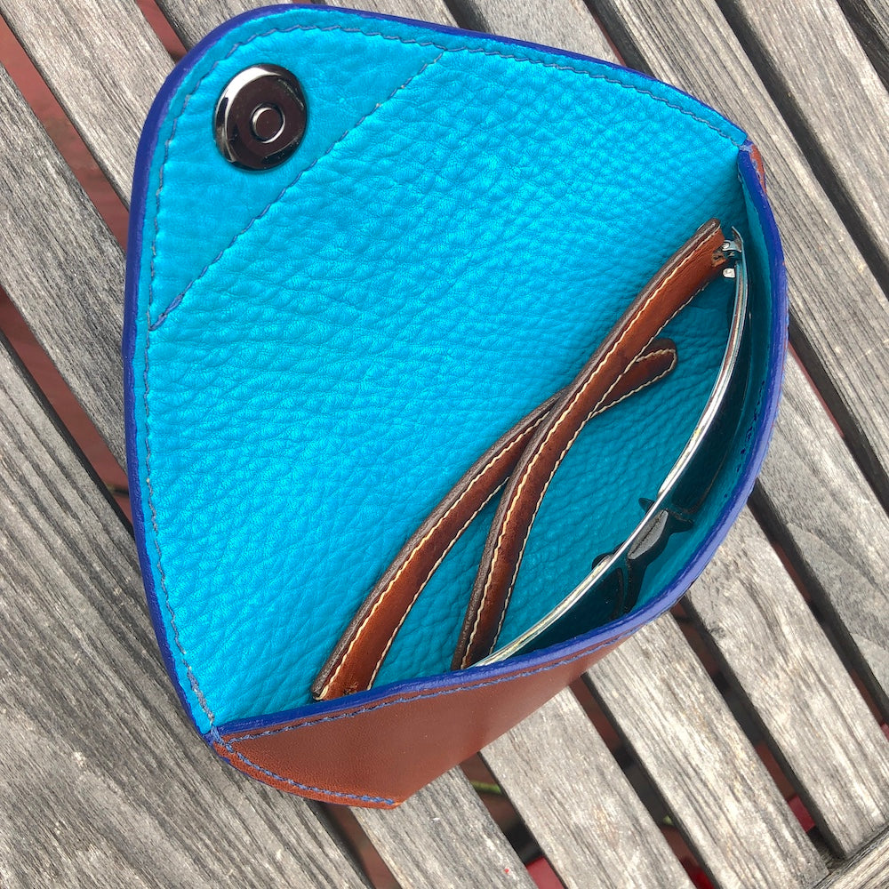 U.S. sourced, saddle stitched cowhide leather case with deerskin lining for prescription eyeglasses and sunglasses. Handcrafted protective case for eyeglasses and sunglasses with magnetic clasp, unisex.