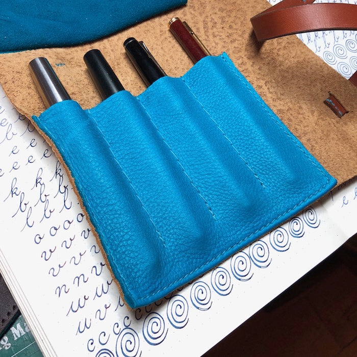 Leather pen wrap for 4 pens.