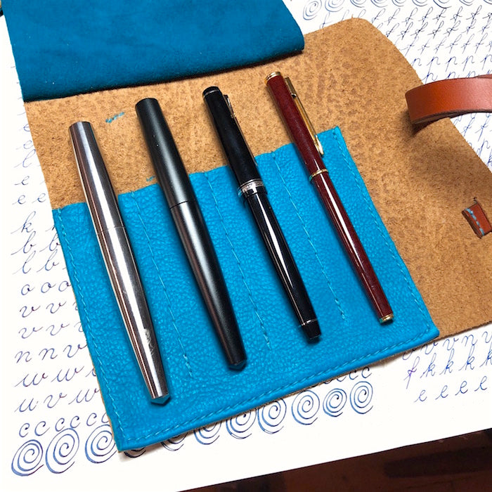 Handmade leather fountain pen case for 4 pens.