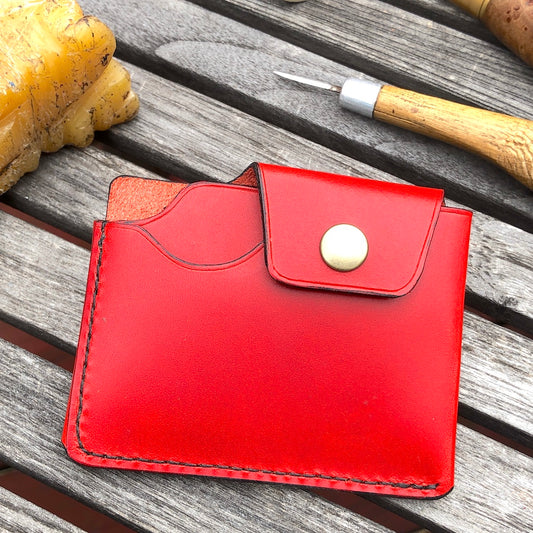 Handcrafted wallet from vegetable dyed cowhide. The edge is coated and polished. Perfect fit for any pocket, front or back, tight or loose, without bulk. It will hold credit cards, drivers license, cash, etc. in 3 compartments
