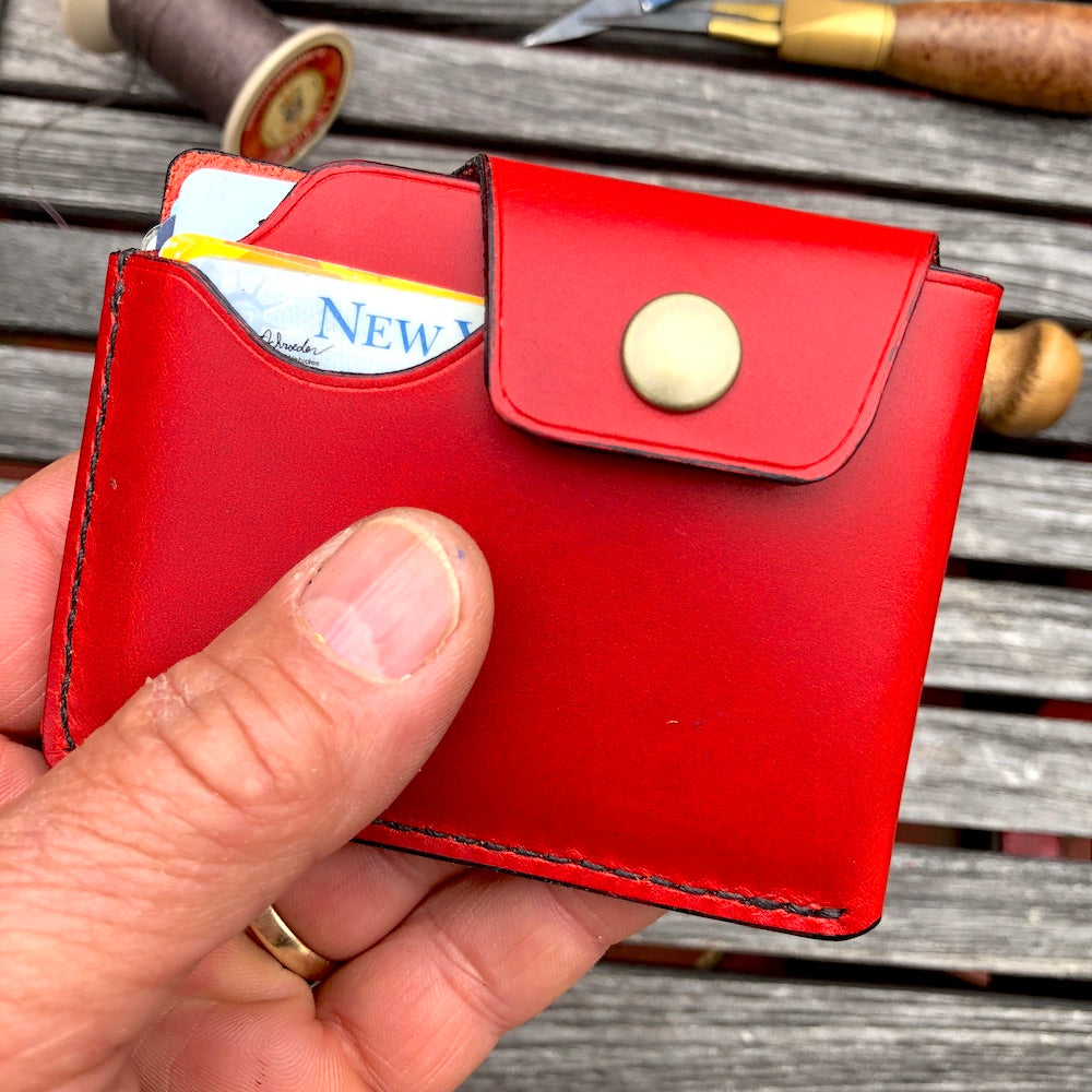 Handcrafted wallet from vegetable dyed cowhide. The edge is coated and polished. Perfect fit for any pocket, front or back, tight or loose, without bulk. It will hold credit cards, drivers license, cash, etc. in 3 compartments.