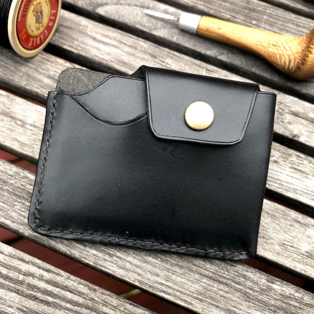 Handcrafted wallet from vegetable dyed cowhide. The edge is coated and polished. Perfect fit for any pocket, front or back, tight or loose, without bulk. It will hold credit cards, drivers license, cash, etc. in 3 compartments