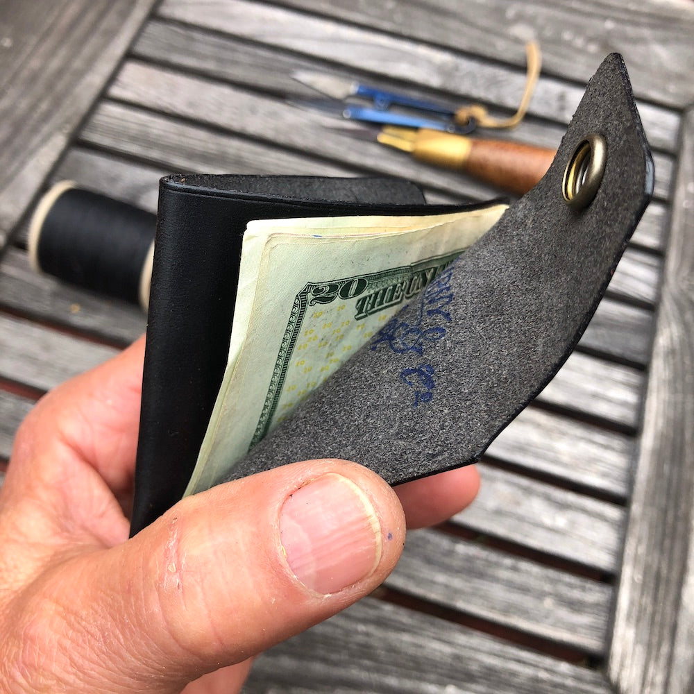 Handcrafted wallet from vegetable dyed cowhide. The edge is coated and polished. Perfect fit for any pocket, front or back, tight or loose, without bulk. It will hold credit cards, drivers license, cash, etc. in 3 compartments.