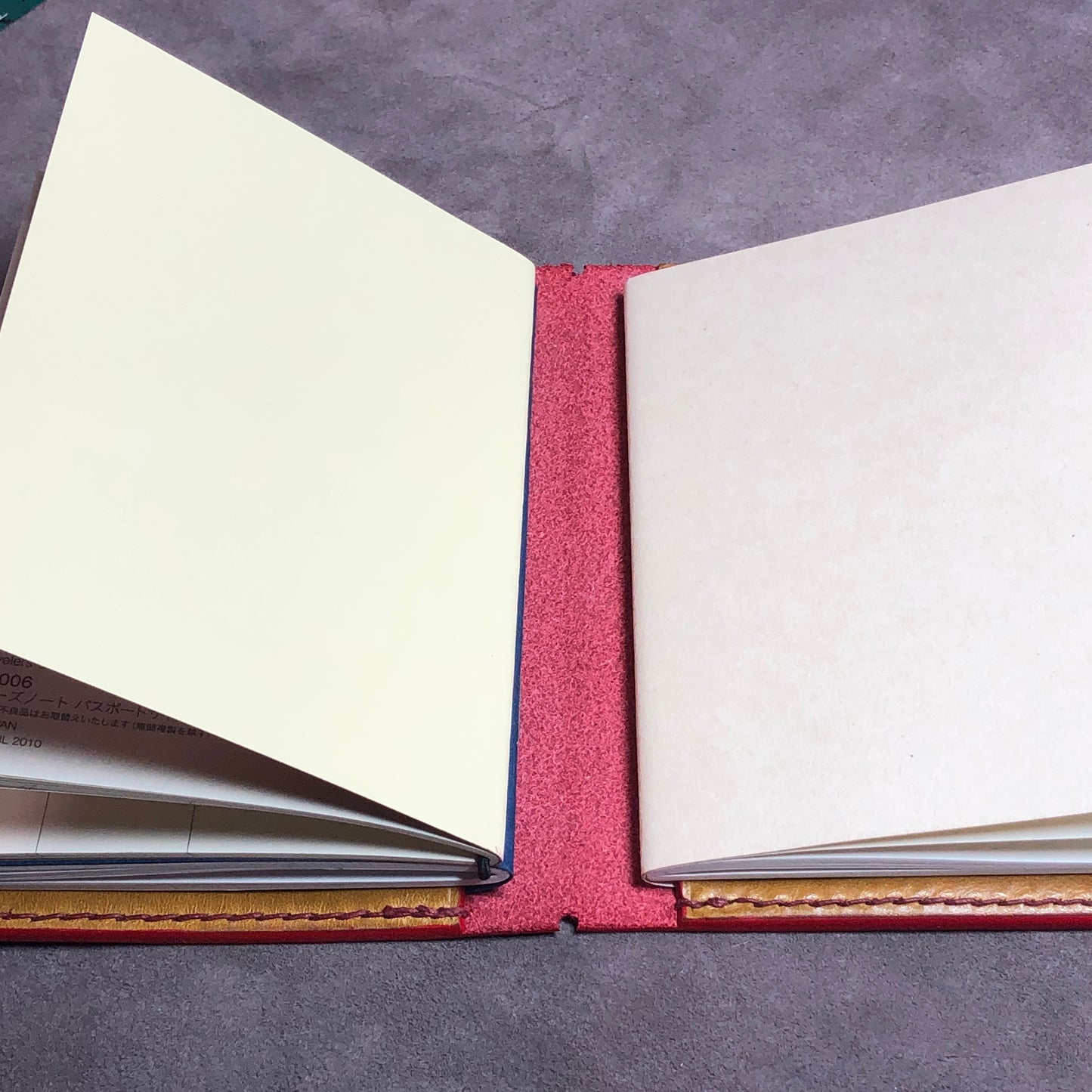 Passport size Travelers Journal cover from Red EPI leather. Hand stitched, finished edges. One Journal included.
