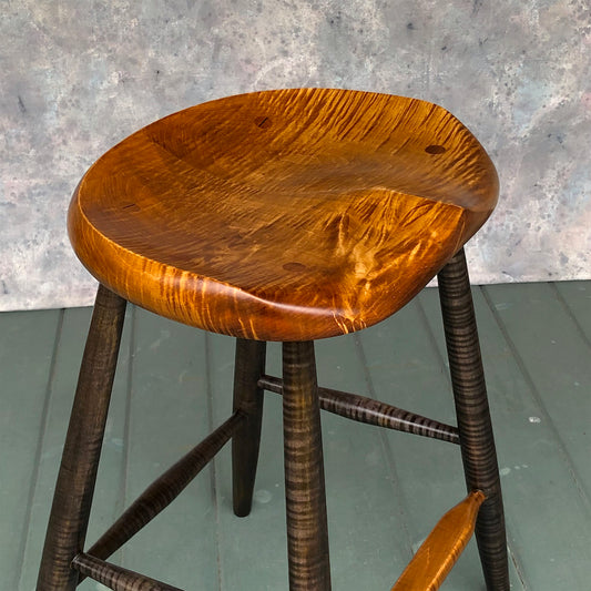 This is a 25" high stool, designed for kitchen counter, kitchen island.<br data-mce-fragment="1">Hand carved from solid tiger maple wood following the anatomical curves of the human body. <br data-mce-fragment="1">No pressure points, the whole surface of the stool will support the upper body.