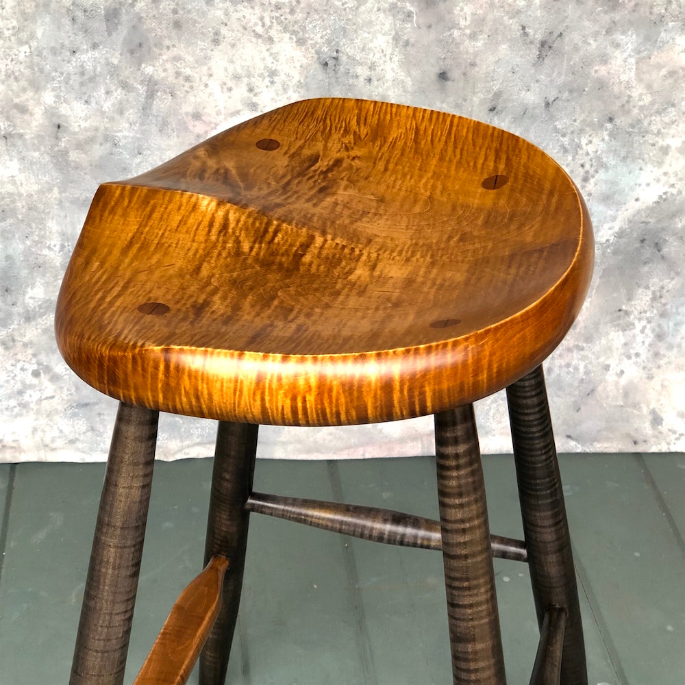 This is a 25" high stool, designed for kitchen counter, kitchen island.<br data-mce-fragment="1">Hand carved from solid tiger maple wood following the anatomical curves of the human body. <br data-mce-fragment="1">No pressure points, the whole surface of the stool will support the upper body.