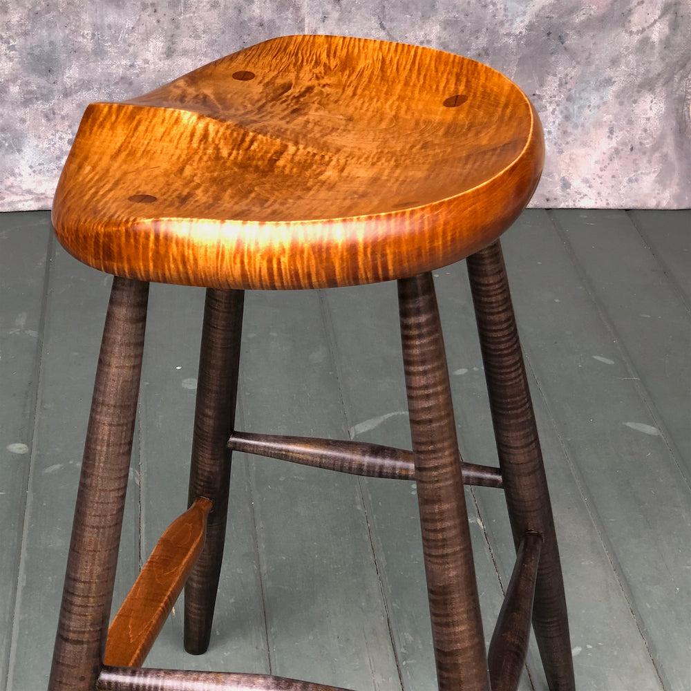 This is a 25" high stool, designed for kitchen counter, kitchen island.<br data-mce-fragment="1">Hand carved from solid tiger maple wood following the anatomical curves of the human body. <br data-mce-fragment="1">No pressure points, the whole surface of the stool will support the upper body.