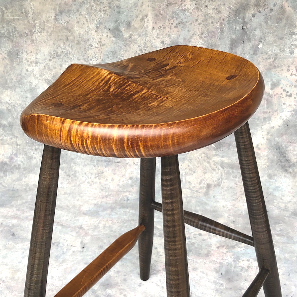This is a 25" high stool, designed for kitchen counter, kitchen island.<br data-mce-fragment="1">Hand carved from solid tiger maple wood following the anatomical curves of the human body. <br data-mce-fragment="1">No pressure points, the whole surface of the stool will support the upper body.