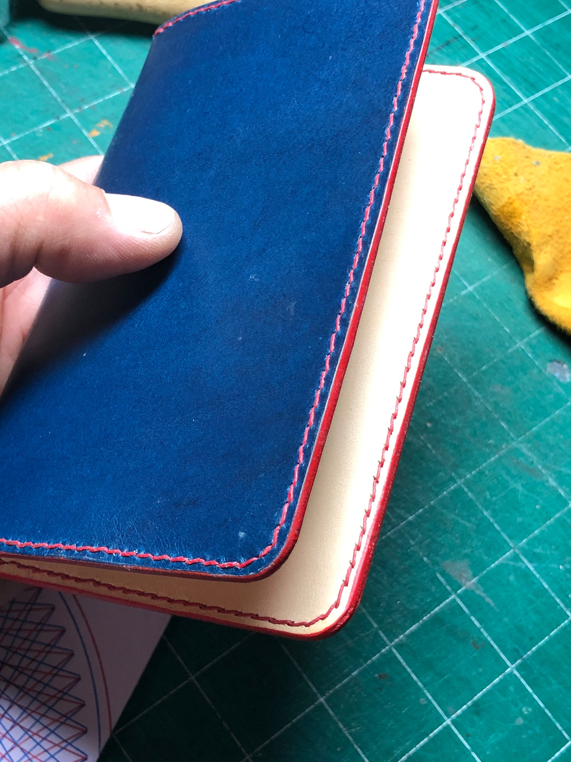 Blue Leather Field Notes cover with 2 pockets. Hand stitched with red waxed linen, finished red edges. 