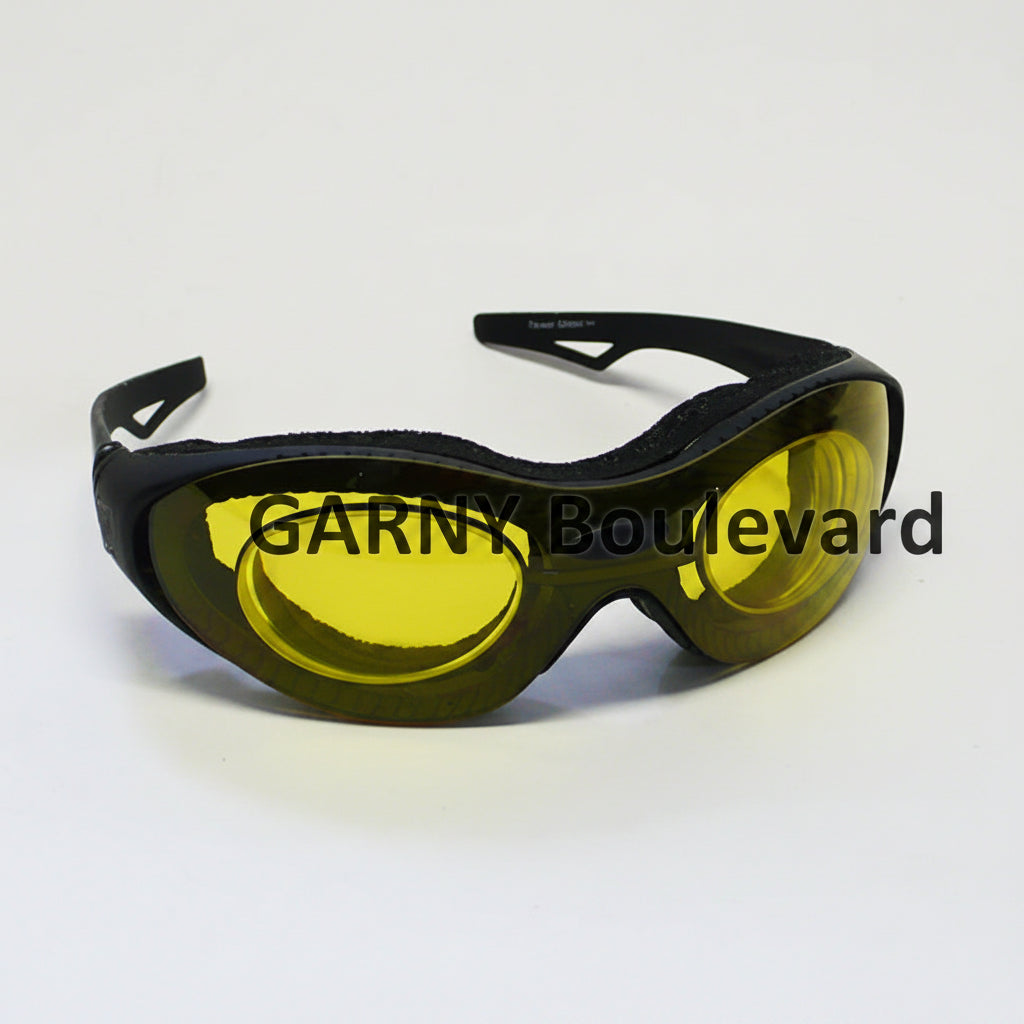 Yellow safety goggles with black frame on a white background