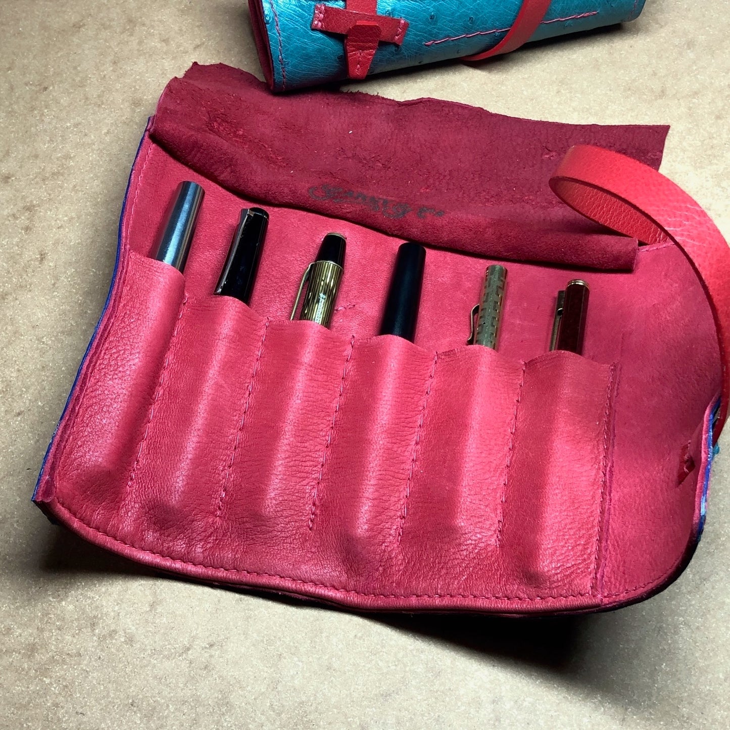 Deerskin lining of a fountain pen roll for 6 pens. 