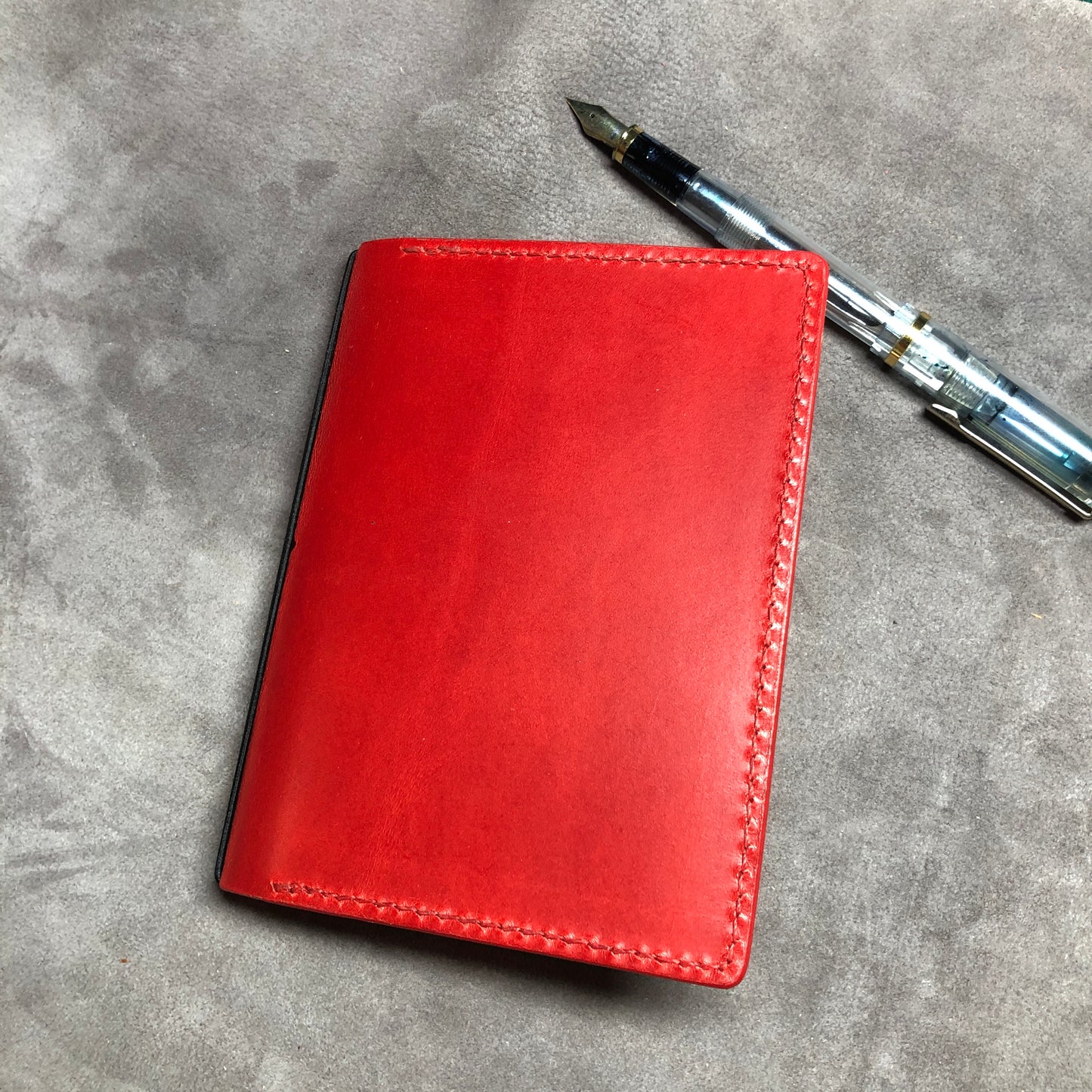 Red cowhide leather Passport size Travelers Journal cover.  Hand stitched, finished edges. One Midori Travelers Notebook Journal included.  Refillable, pocket-size. 